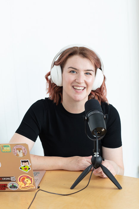 Sarah Young at her laptop, recording a podcast episode